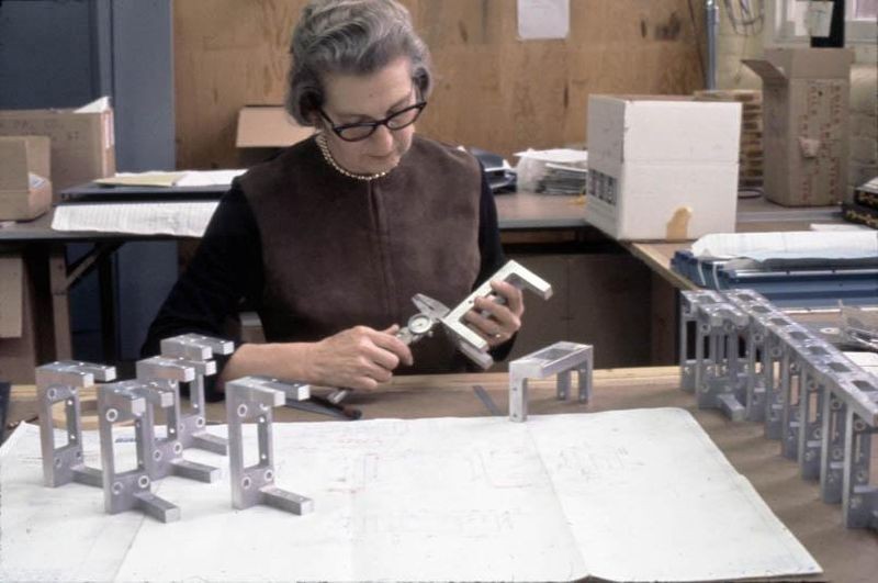Using a micrometer, an engineer checks the tolerances of a mass-produced component used in DEC computers, ca. 1965. DEC was one of the earliest companies to hire women engineers. Digital Equipment Corporation Records at the Computer History Museum, 102755967.