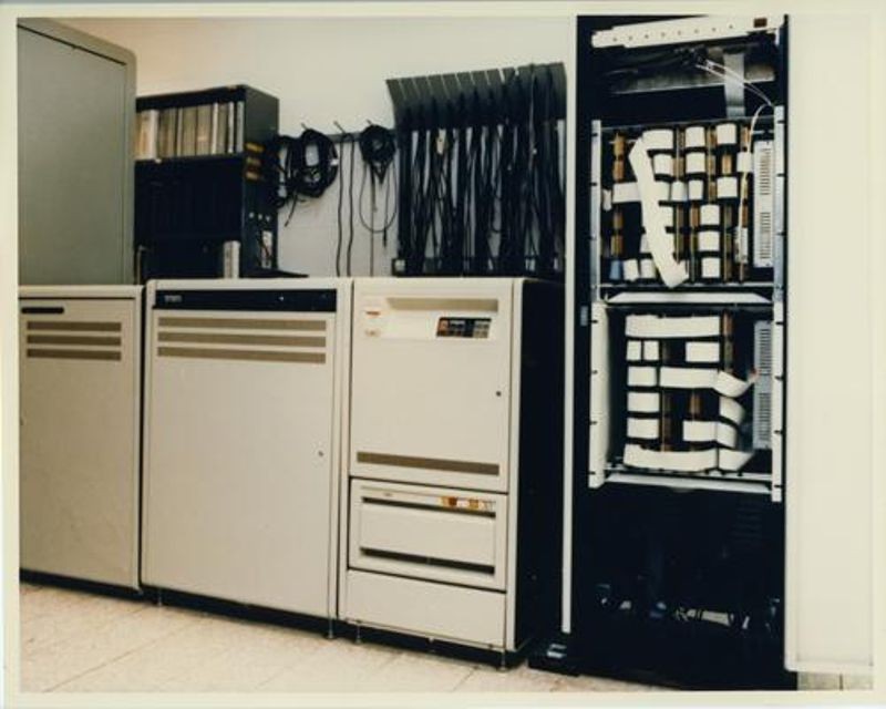SETI equipment at DSS13, Goldstone, California, consisting of (Left to Right) a power conditioner, VAX 11/750, tape and disk drives, and the MCSA 1. CHM# 102657160/Courtesy of NASA Ames