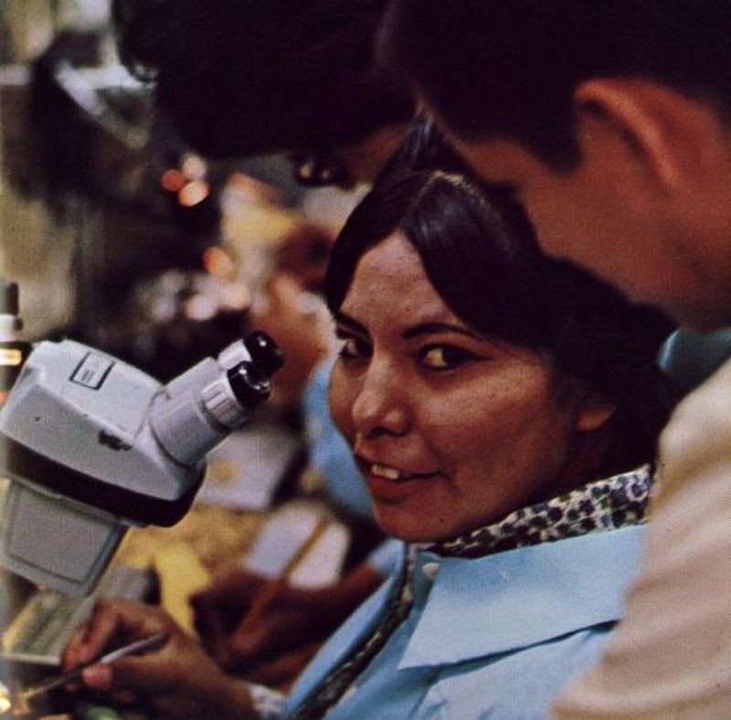 Figure 6: Navajo woman at microscope in fabrication laboratory
