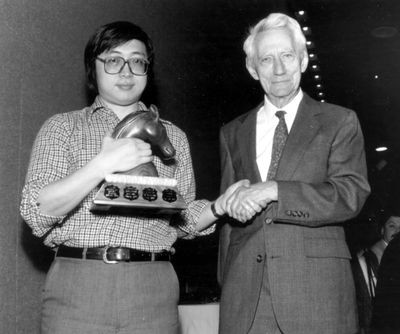 Claude Shannon awards Feng-Hsiung Hsu first prize for Deep Thought at the World Computer Chess Championship in Edmonton, Alberta