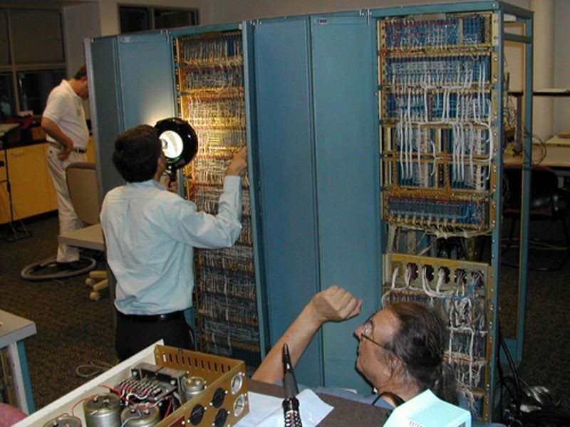 Joe Fredrick and Lyle Bickely inspecting PDP-1 backplane as part of the PDP-1 restoration project