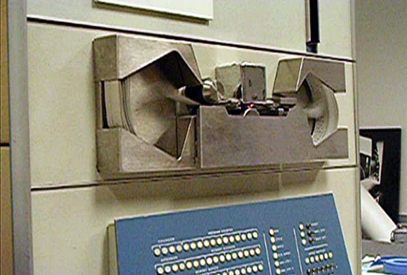 Paper tape being read through PDP-1 tape reader during the Computer History Museum PDP-1 restoration project