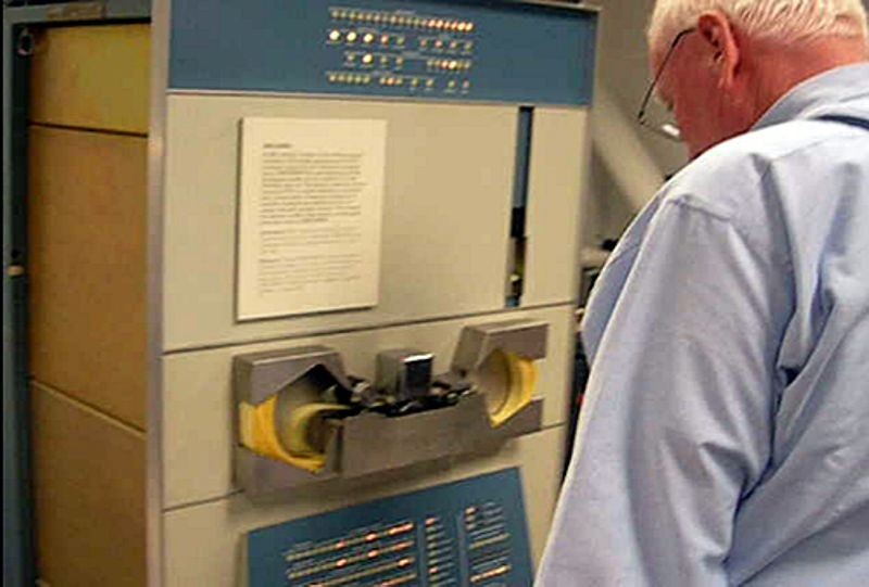 Peter Samson loading music program through PDP-1 tape reader during the Computer History Museum PDP-1 restoration project