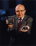 Jack Kilby with the first palm-sized calculator