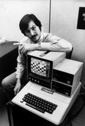 Steve Jobs with Apple II and disk drives