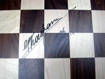 Close-up showing Kasparov signature of chess board and pieces used in the