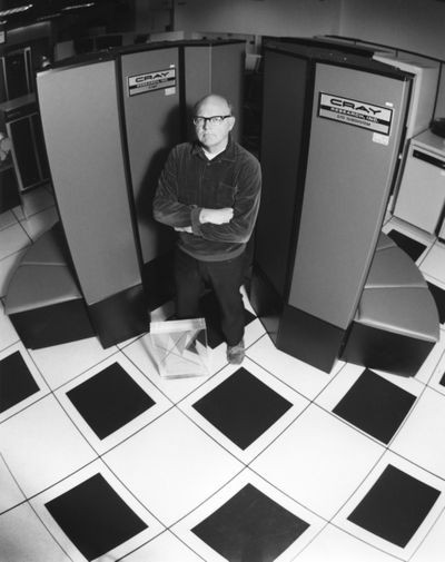 Harry Nelson, co-developer of chess program Cray Blitz, in front of Cray supercomputer