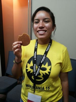 Attendee eating a Stroopwafel at Wikimania 2015, Mexico City