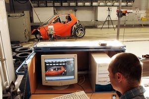 Test engineer monitoring car crash on computer

