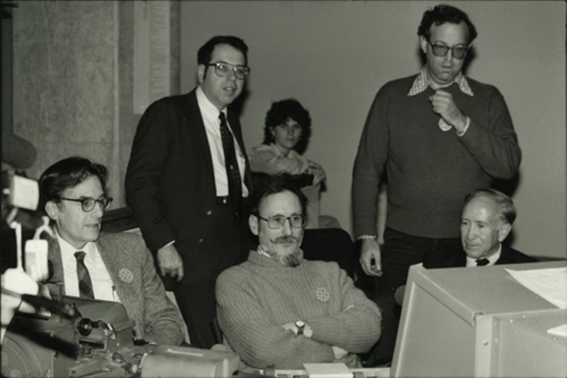 Early MIT computing pioneers at The Computer Museum, Boston, observing restored TX-0 computer. From left to right: Jack Dennis, Alan Kotok, Martin "Shag" Graetz, Dave Gross and John McKenzie