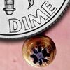Physically-isolated Micrologic flip-flop compared to a dime from LIFE magazine March 10, 1961
