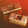 Separate bipolar and CMOS packages comprise a 12-bit ADC (AD574) from 1978