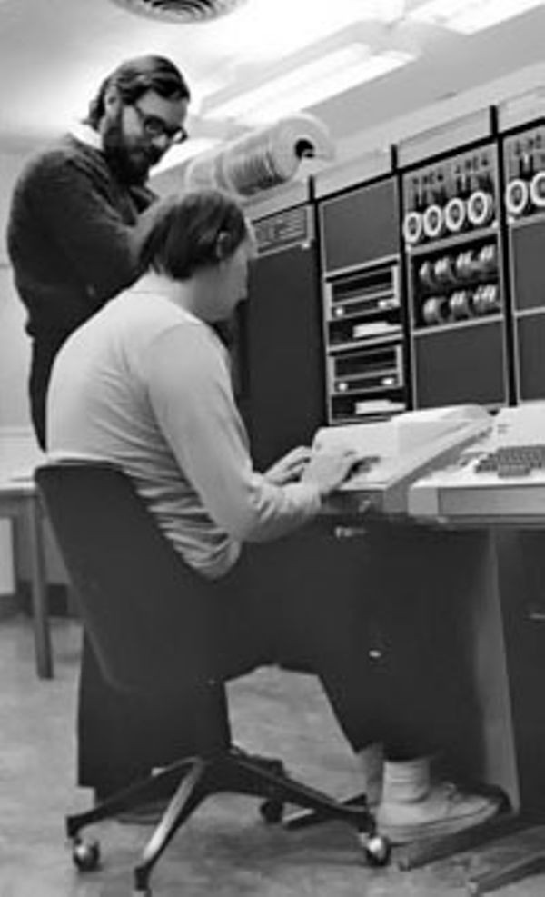 Ken Thompson (sitting) and Dennis Ritchie (standing) in front of a PDP-11 in 1972. 